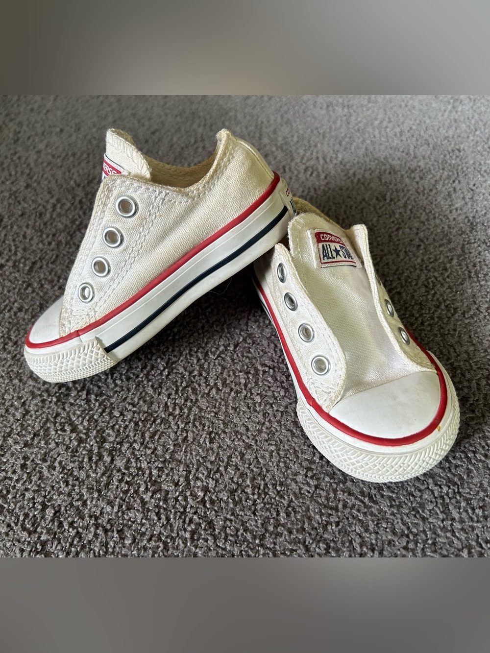 Converse Kids Slip-On Canvas Sneakers in Off-White with Red and Black Trim